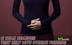 woman holding her abdomen in pain caption home remedies uterine fibroids