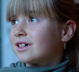 Wide Awake Little Girl with a Smiling Face